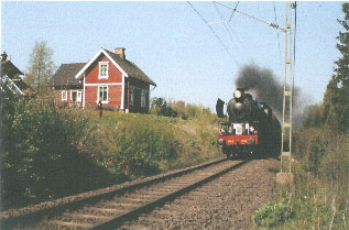 Jubileumståget passerar banvaktsstugan i Grimsås 2002